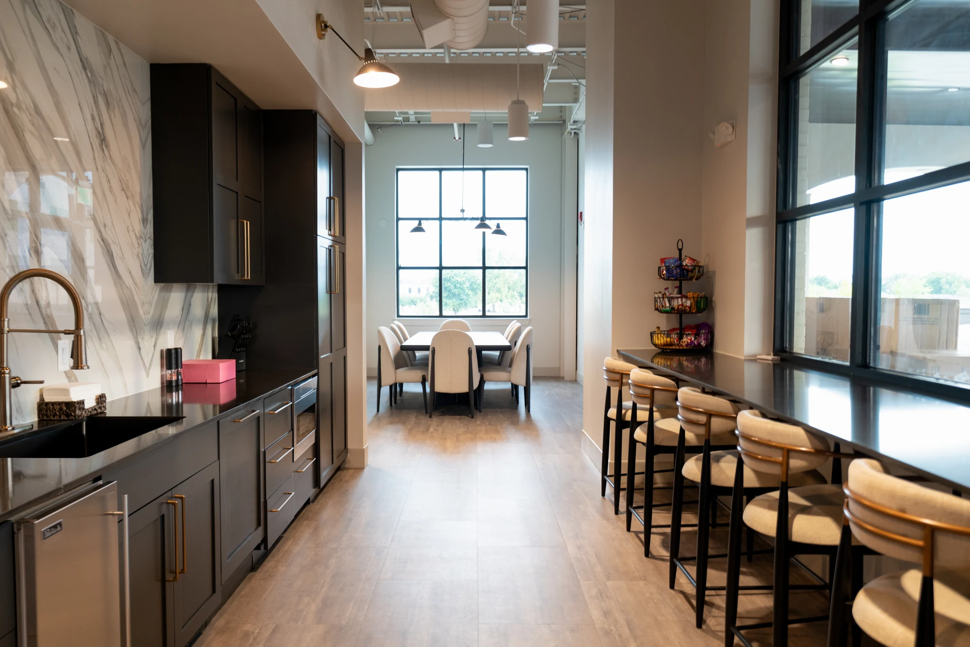 Clean commercial kitchen and bar seating area after office cleaning in Northwest Arkansas