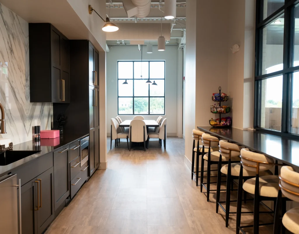 Clean commercial kitchen and bar seating area after office cleaning in Northwest Arkansas