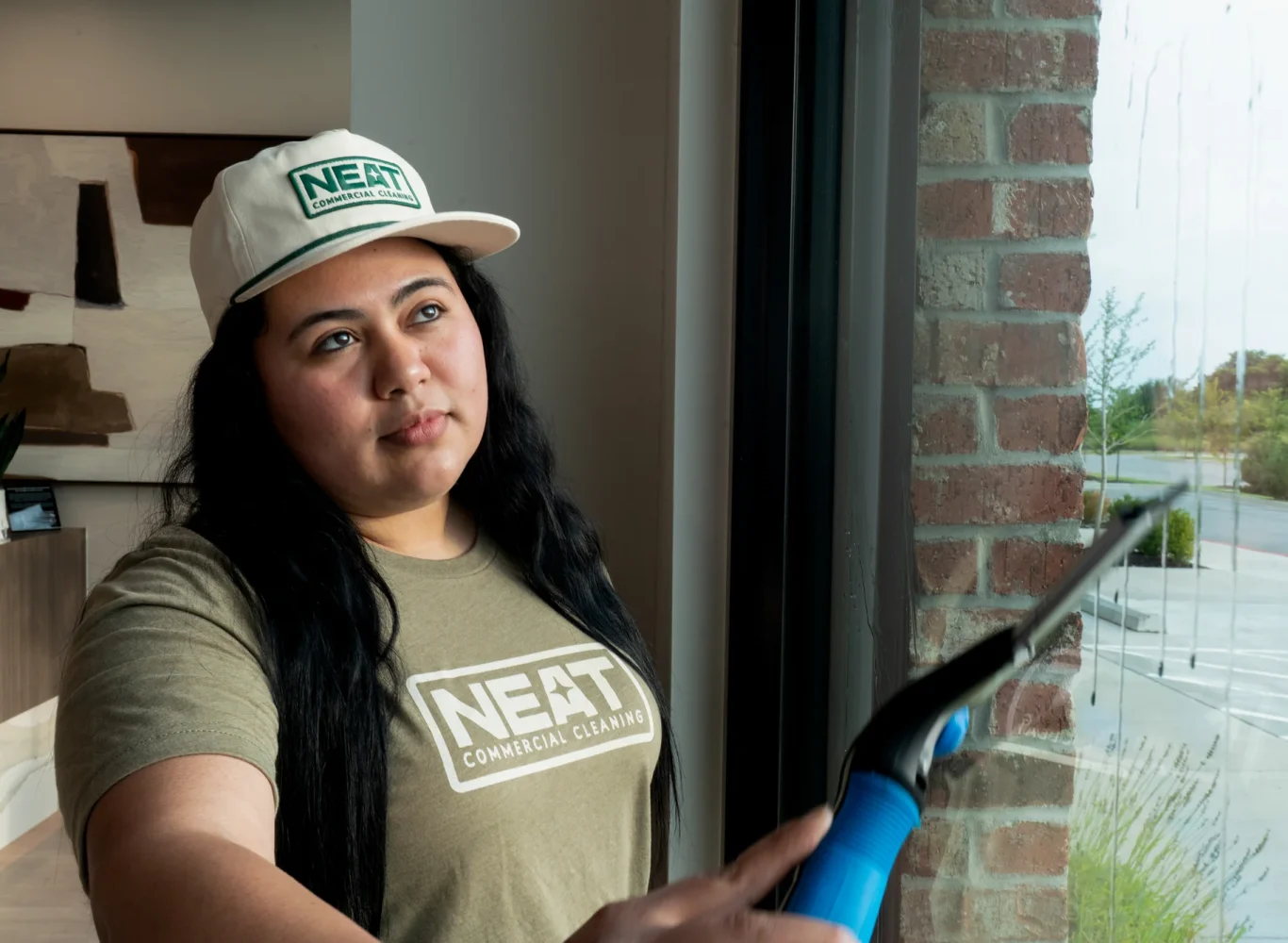 Professional commercial window cleaning with squeegee in Washington County, AR