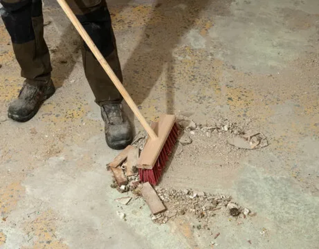 Cleaner removing fine construction dust from finished surfaces in a Centerton commercial property.