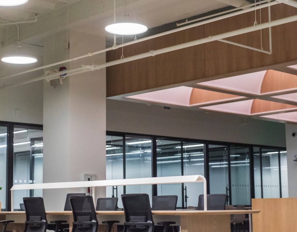 Neat Commercial Cleaning staff sanitizing office desks in Rogers, AR