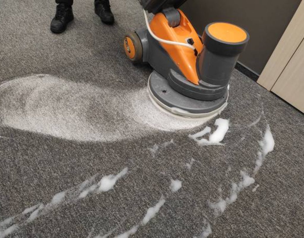 Neat Commercial Cleaning specialists performing expert carpet cleaning in business environments.