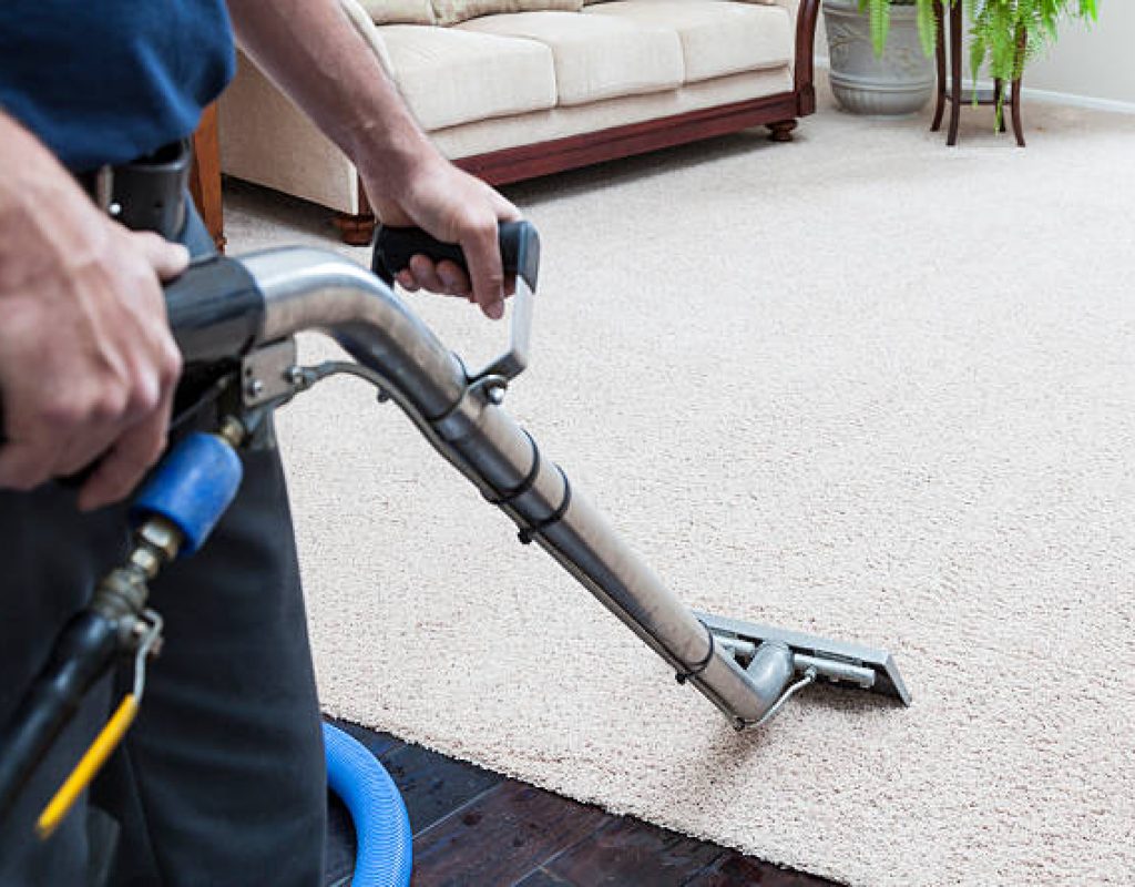 Commercial cleaning team using equipment for deep carpet cleaning