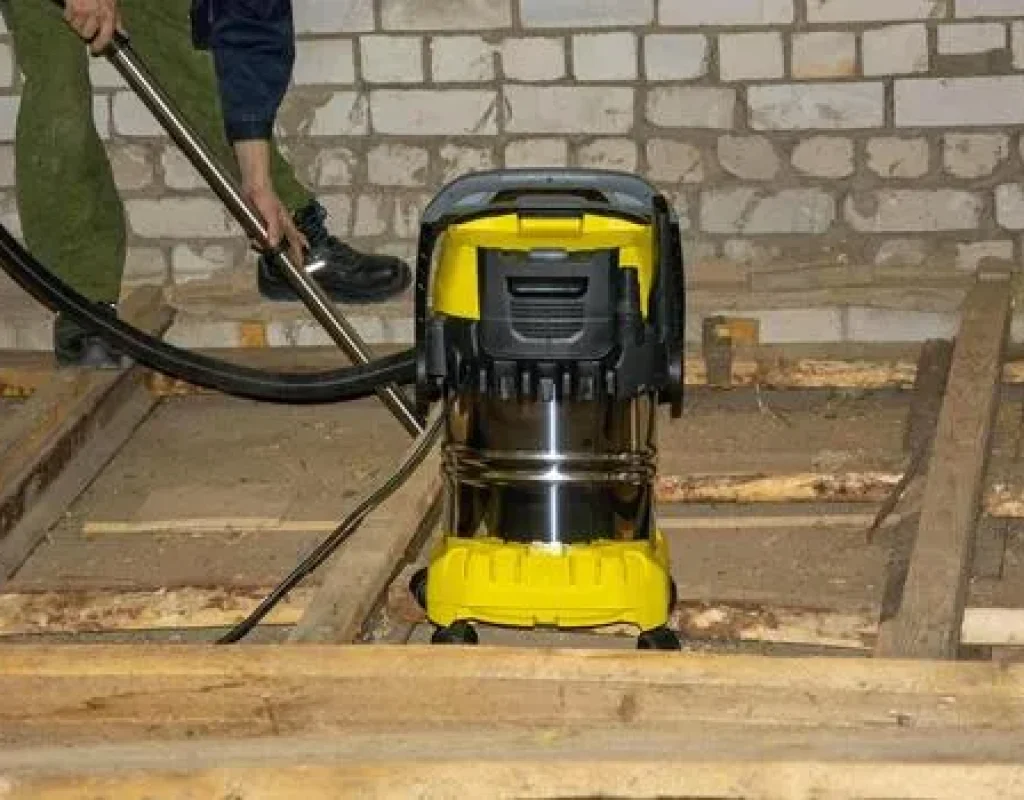 Cleaner detailing floors and entry areas after a tenant build-out in Fayetteville, AR.